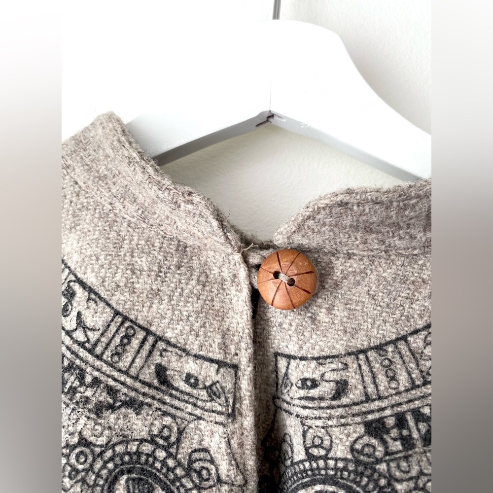 Fringed hem poncho with Egyptian-look print around collar - Picture 7 of 13